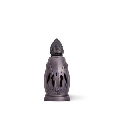 Palette 21 Ahmed Al Maghribi Wesaf perfume bottle in a dark metallic finish with an ornate pointed cap