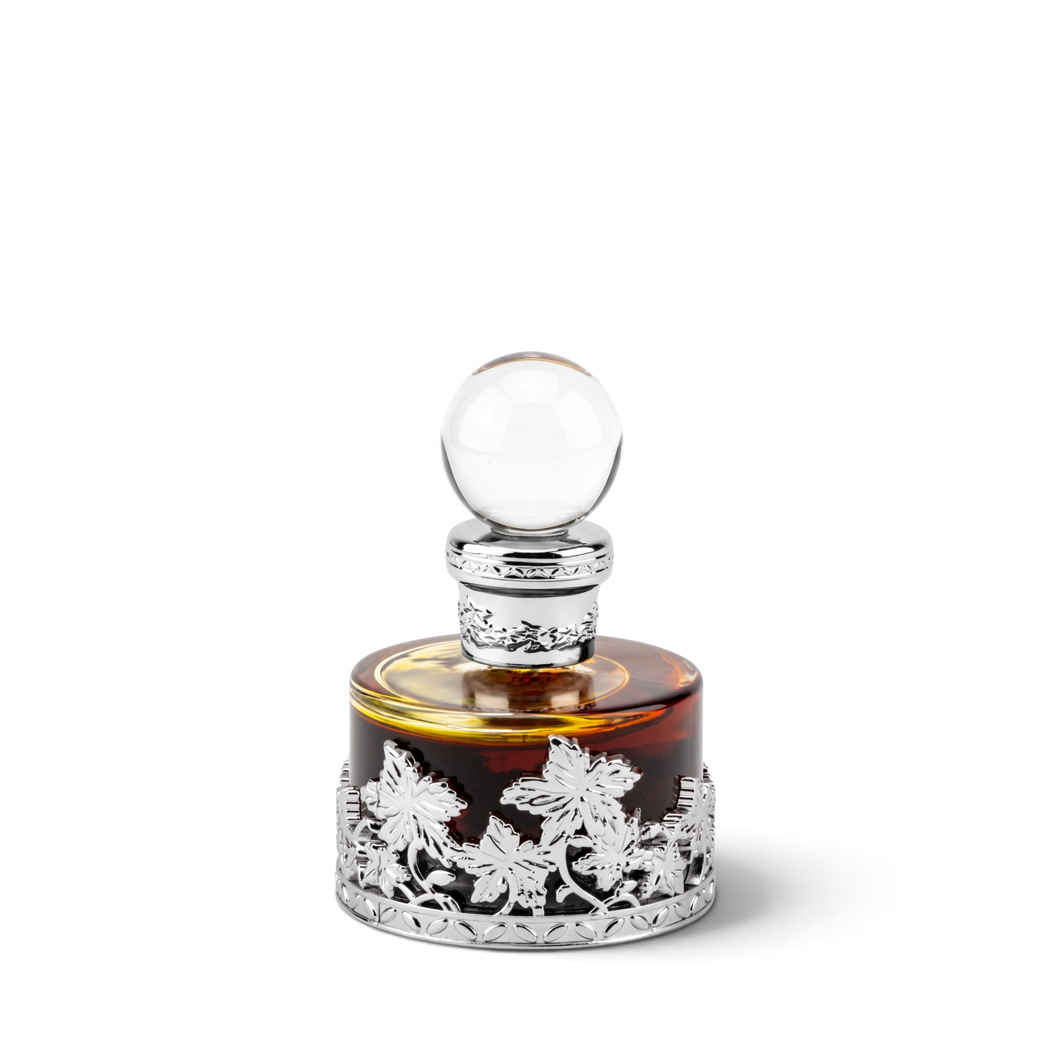 Palette 21 Mukhalat Malaki 207 25ml perfume oil in a round amber glass bottle with ornate silver floral filigree