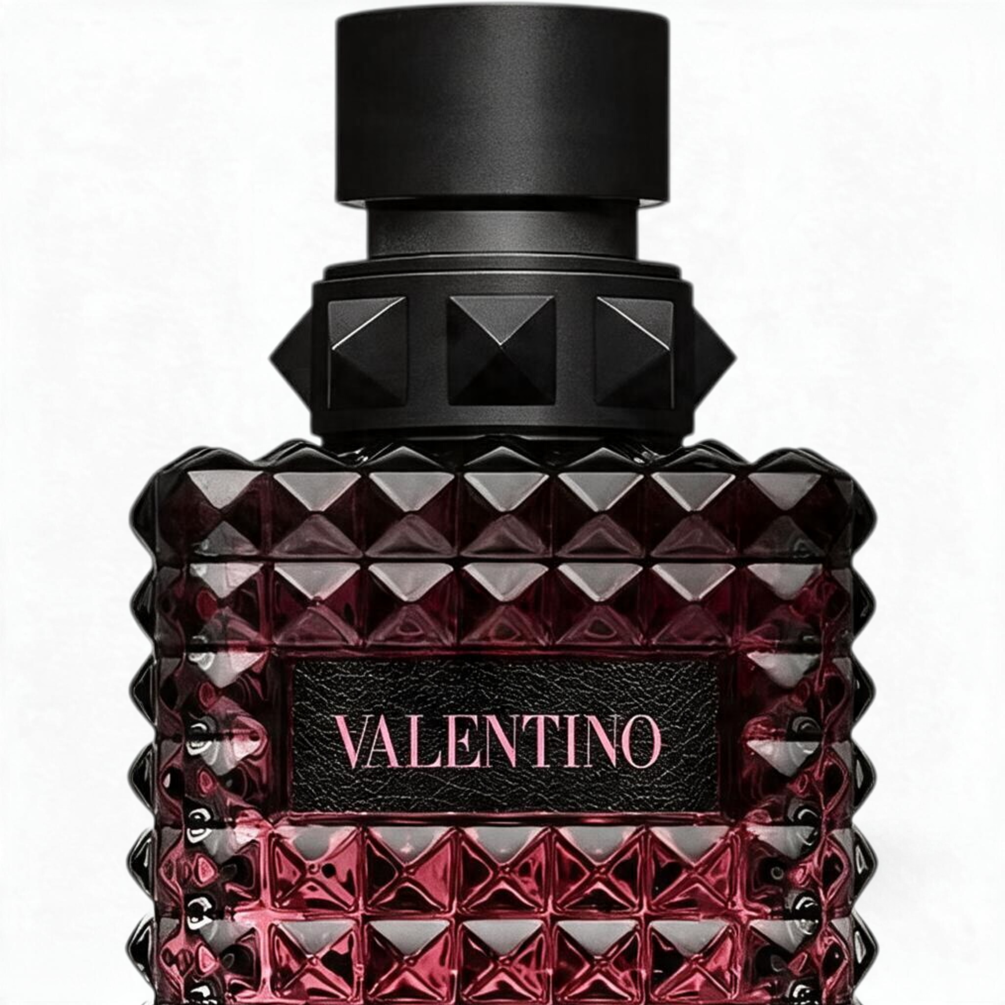 Palette 21 Valentino Donna Born in Roma Intense perfume bottle with iconic black studded design on a white background