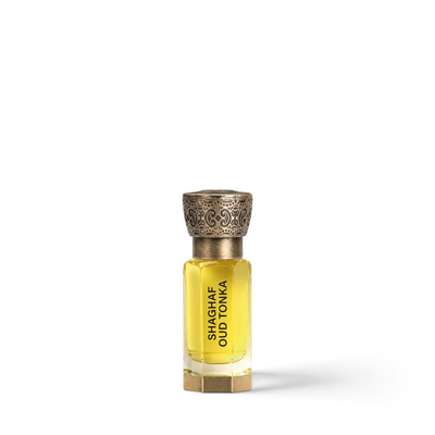 Palette 21 Shaghaf Oud Tonka 12ml concentrated perfume oil in a clear glass bottle with an ornate bronze cap