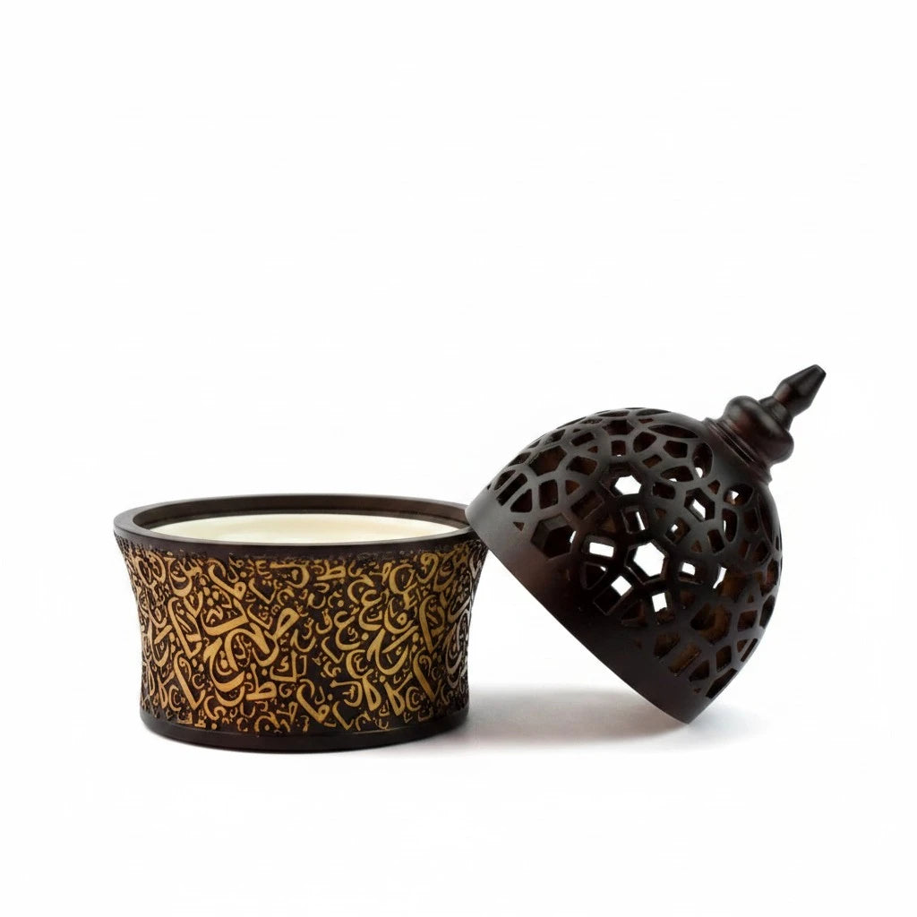 Decorative  Black Bakhoor Burner with intricate design and open lid on a white background
