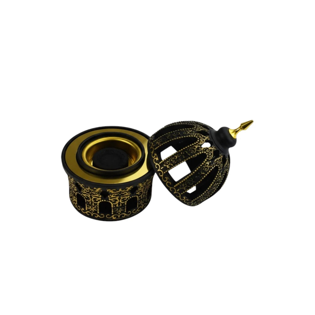 Decorative Black and Gold Bakhoor Burner on a white background