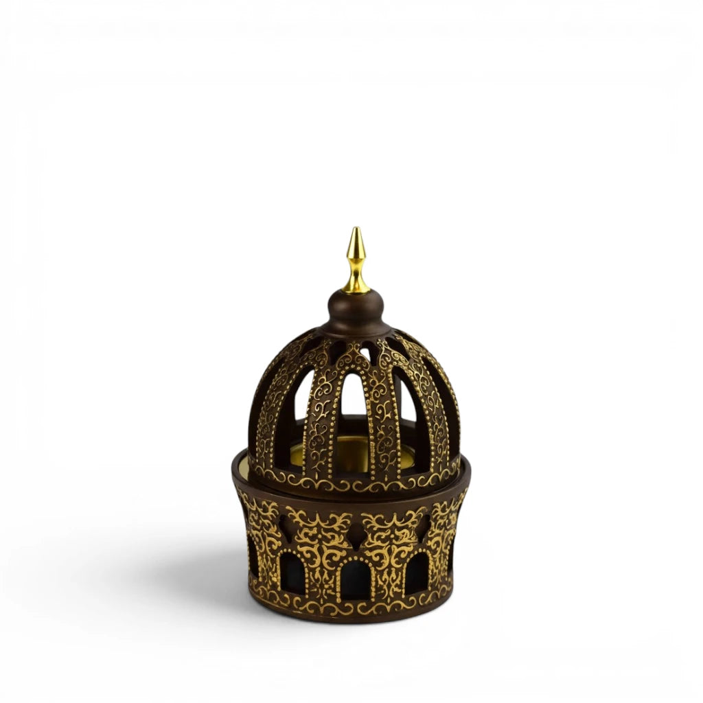 Decorative Golden Bakhoor Burner  with intricate design on a white background