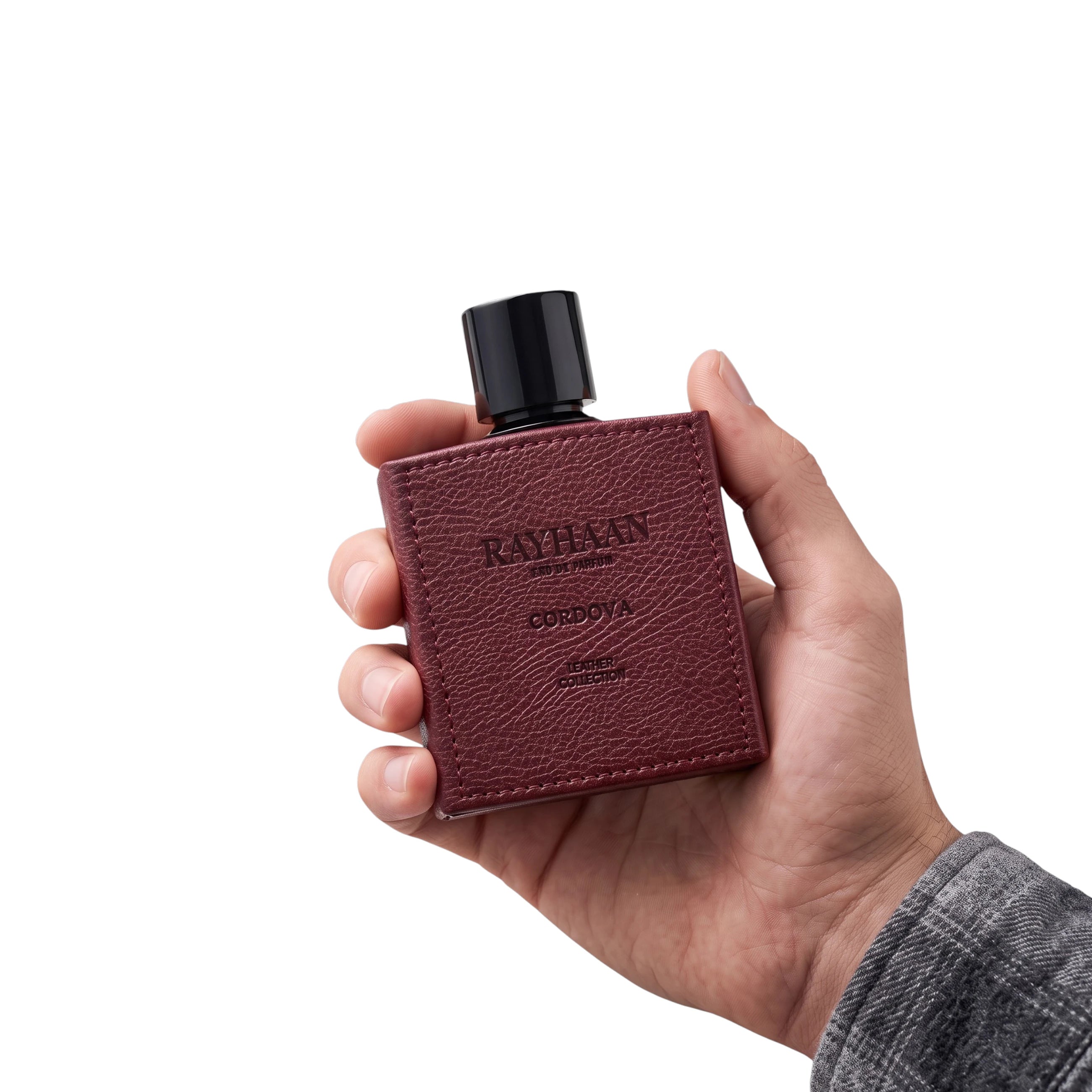 Hand holding Cordova by Rayhaan woody amber perfume bottle