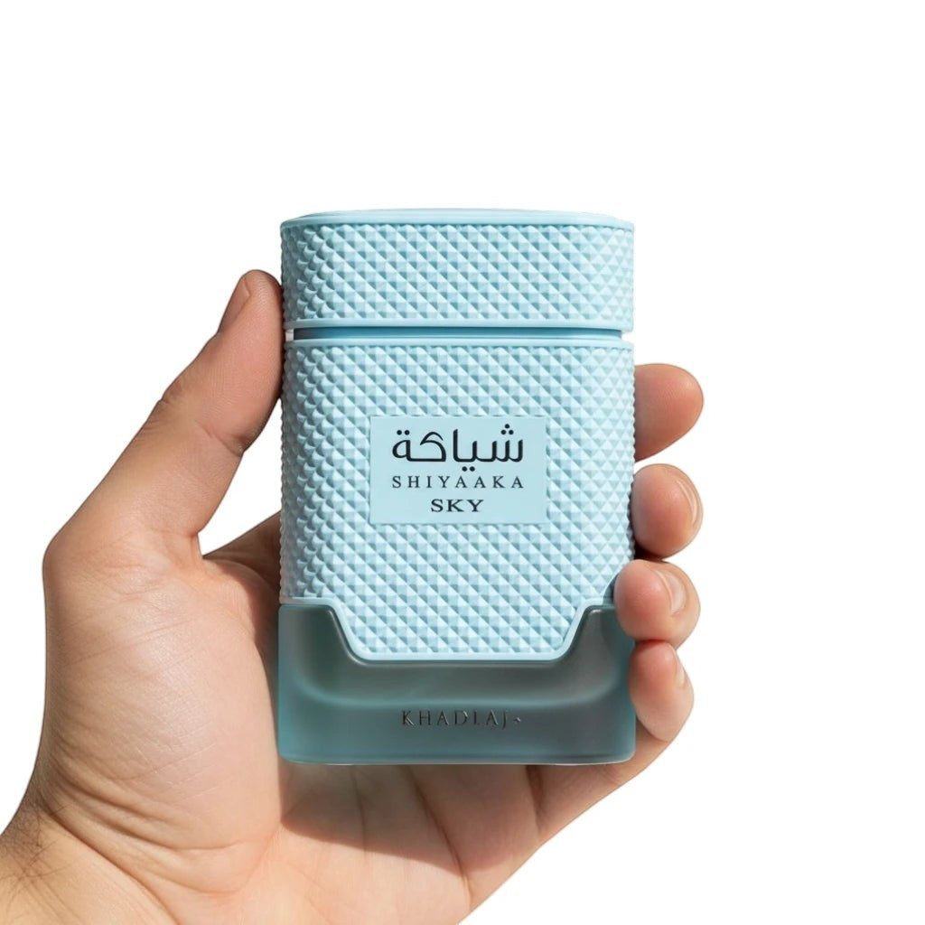 Khadlaj Shiyaaka Sky Eau de Parfum bottle held in hand showing scale and textured design