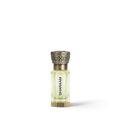 Palette 21 GHARAAM 12ml concentrated perfume oil in a clear glass bottle with an ornate antique brass cap
