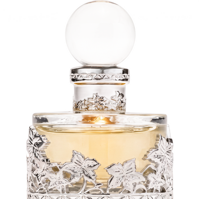 Palette 21 Musk Malaki 207 concentrated perfume oil in a decorative glass bottle with intricate silver leaf detailing