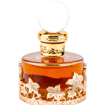 Palette 21 Oud Malaki 207 concentrated perfume oil in a decorative gold filigree bottle with a clear glass stopper.