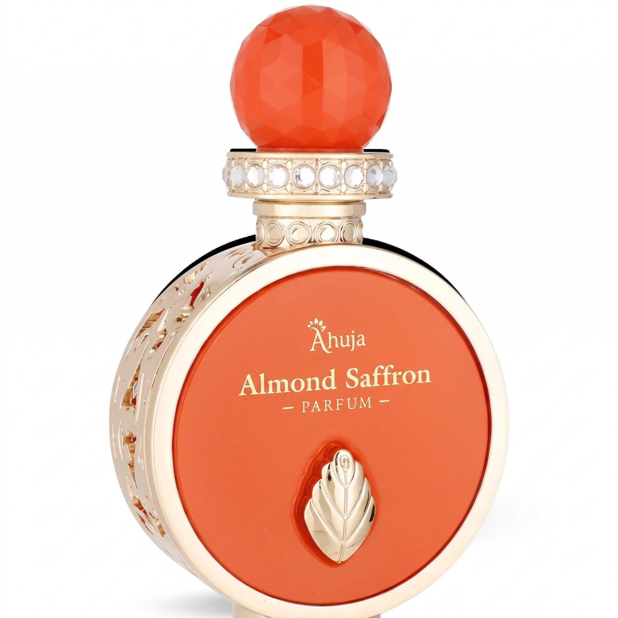 Palette 21 Ahuja Almond Saffron parfum bottle in orange with gold filigree, crystal cap, and leaf emblem.