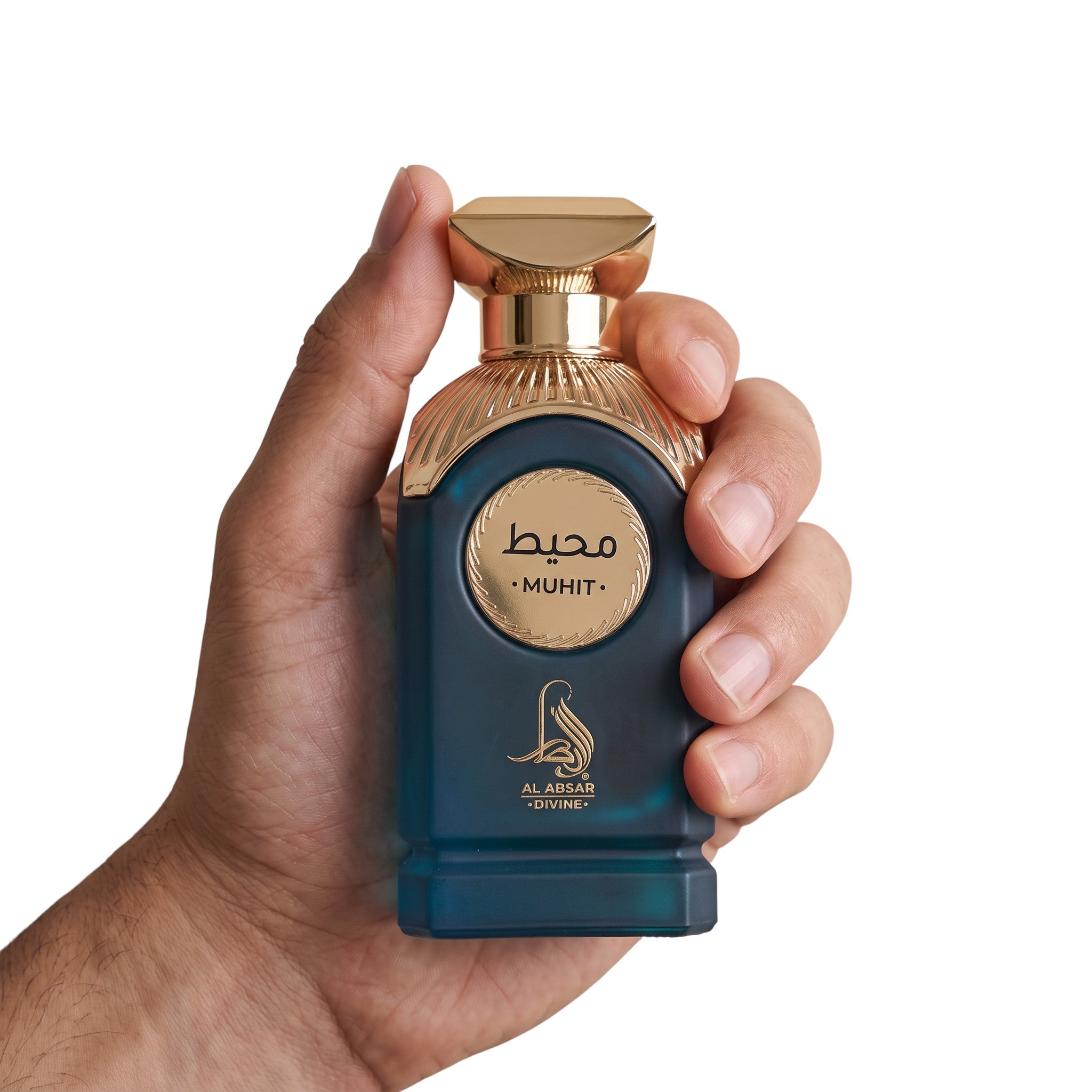 Palette 21 AL ABSAR Muhit unisex eau de parfum in a deep teal bottle with gold accents held in a hand