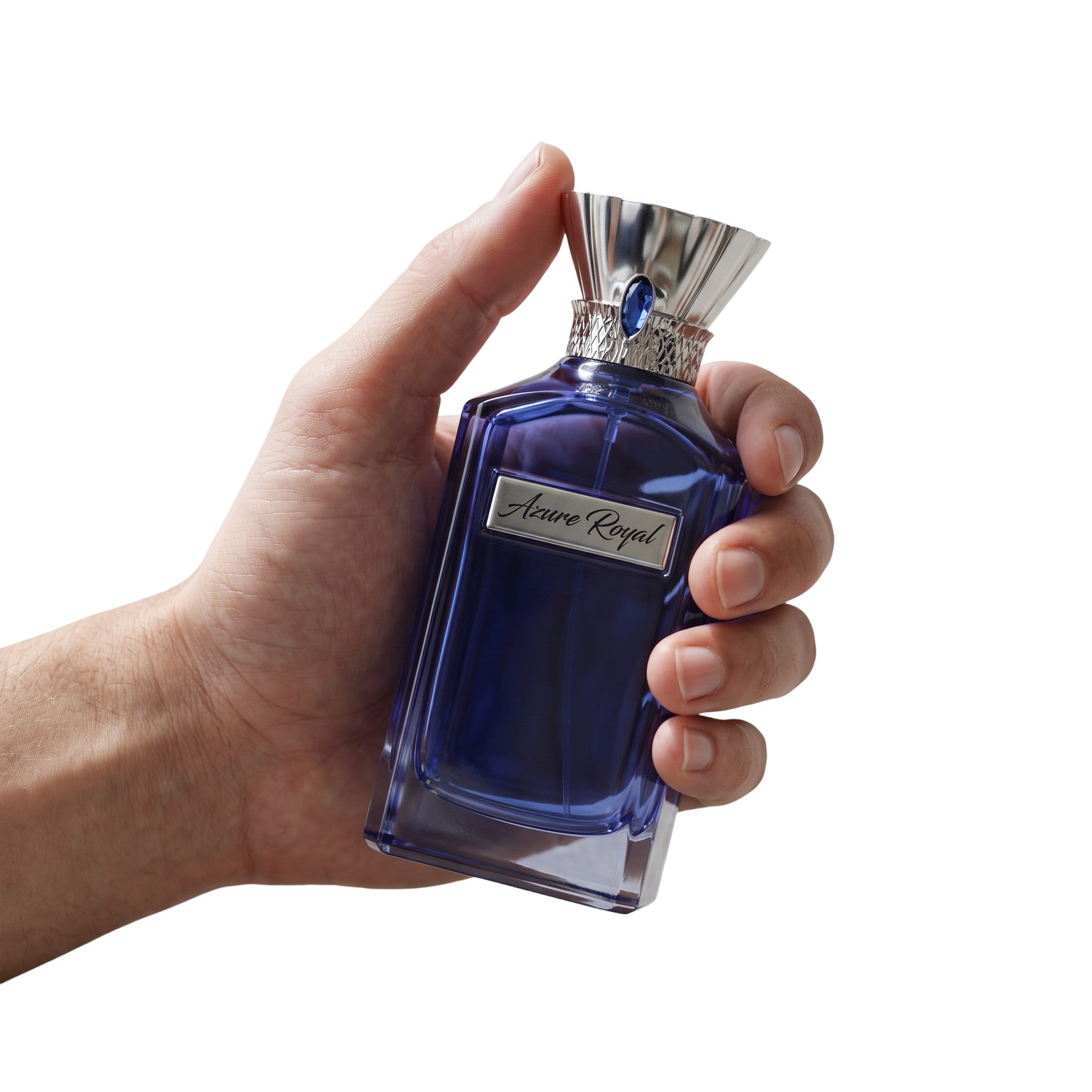 Palette 21 Azure Royal eau de parfum in a deep blue glass bottle with silver accents held in a hand