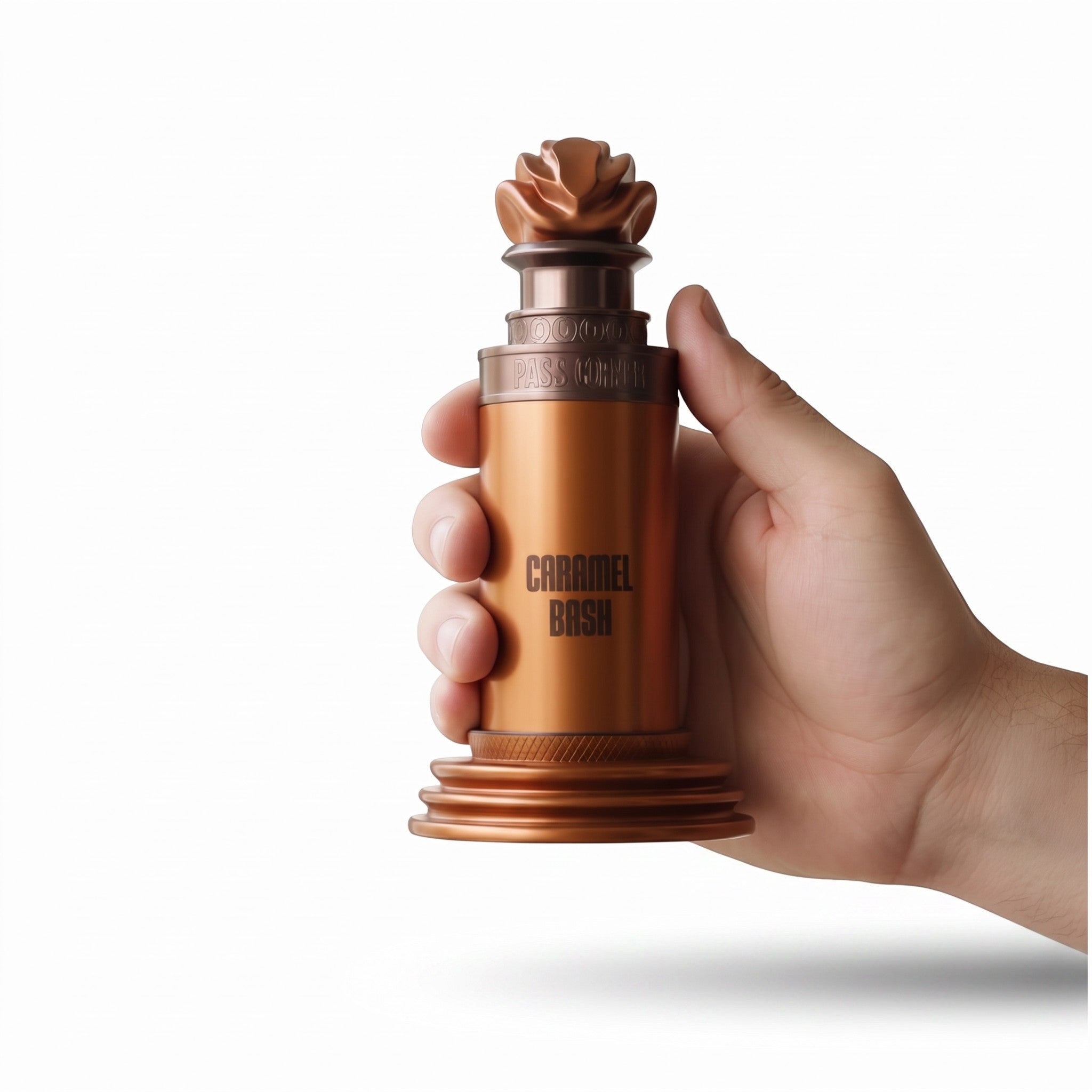 Palette 21 Paris Corner Caramel Bash unisex gourmand perfume bottle held in a hand, featuring a metallic bronze finish.