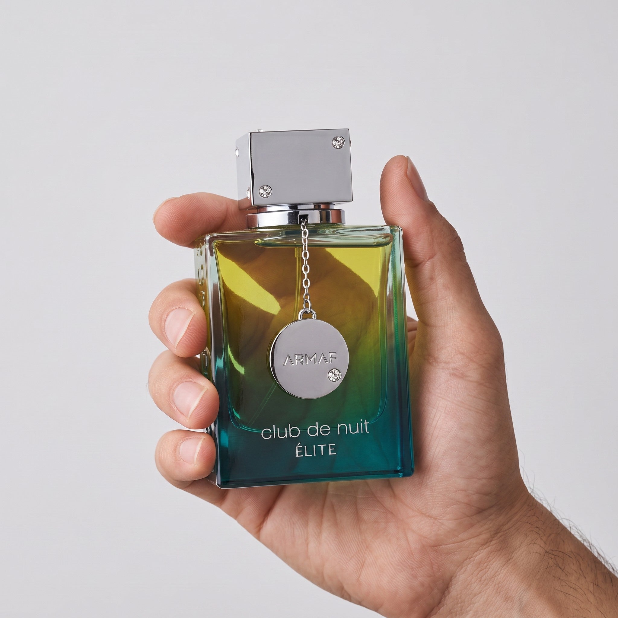 Palette 21 Club De Nuit Elite Armaf men's fragrance in a square glass bottle with a green to blue gradient finish