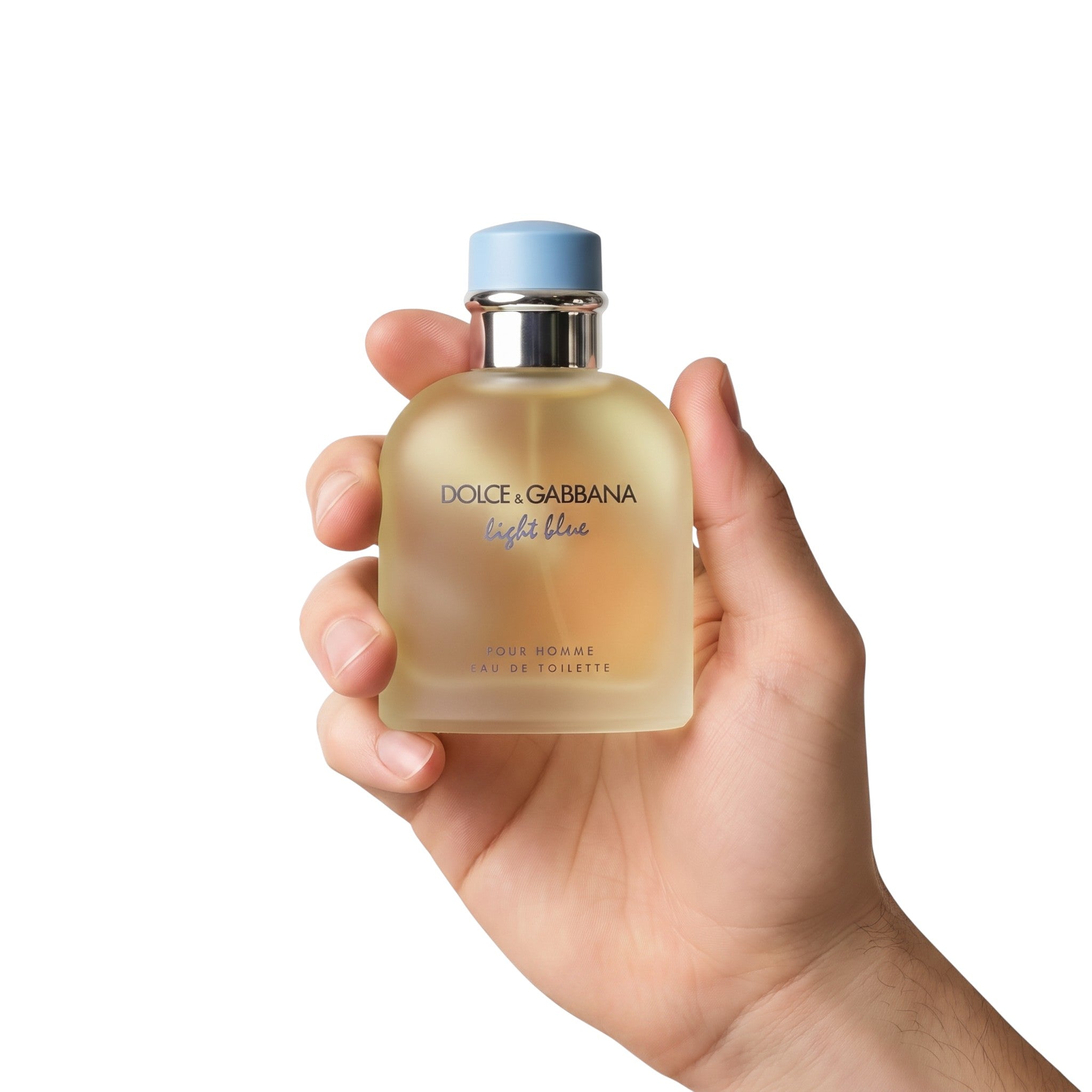 Palette 21 Dolce & Gabbana Light Blue pour Homme eau de toilette bottle held in a hand against a white background