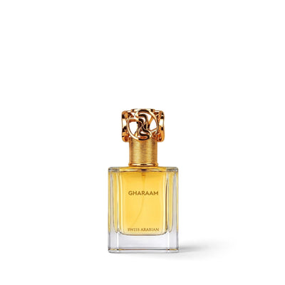 Palette 21 Gharaam perfume bottle with golden liquid and an ornate metallic gold cap on a white background