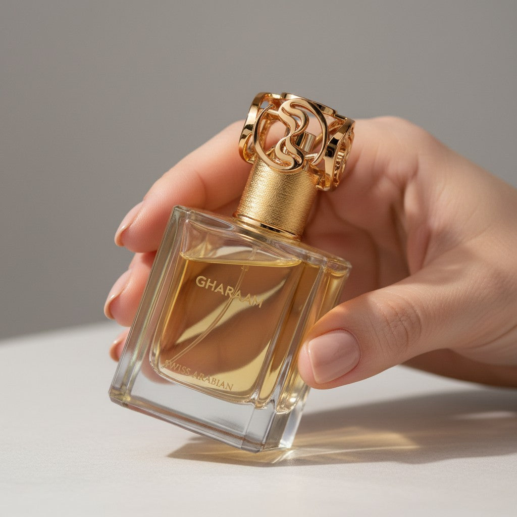 Palette 21 Gharaam perfume bottle with a gold ornate cap held in a hand against a neutral background