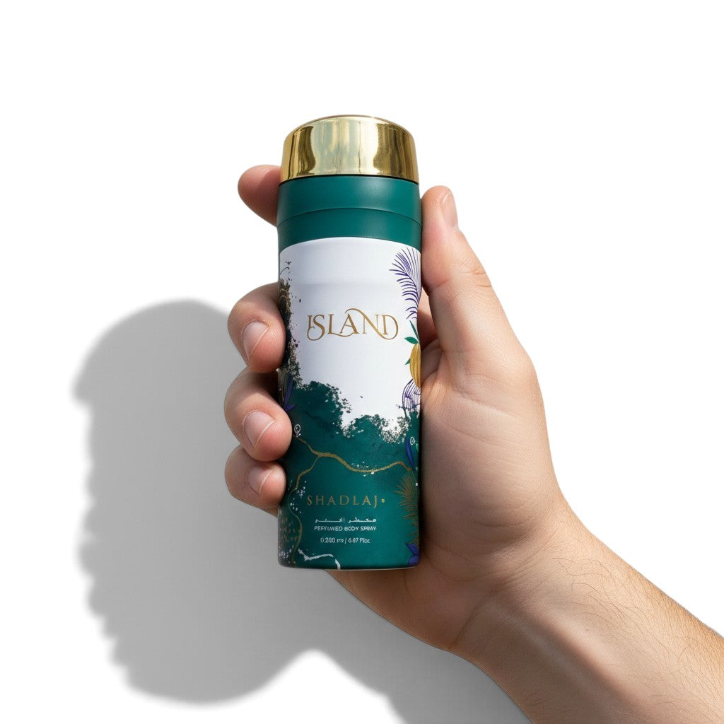 Palette 21 Khadlaj Island perfumed body spray in a green and gold bottle held in a hand against a white background.