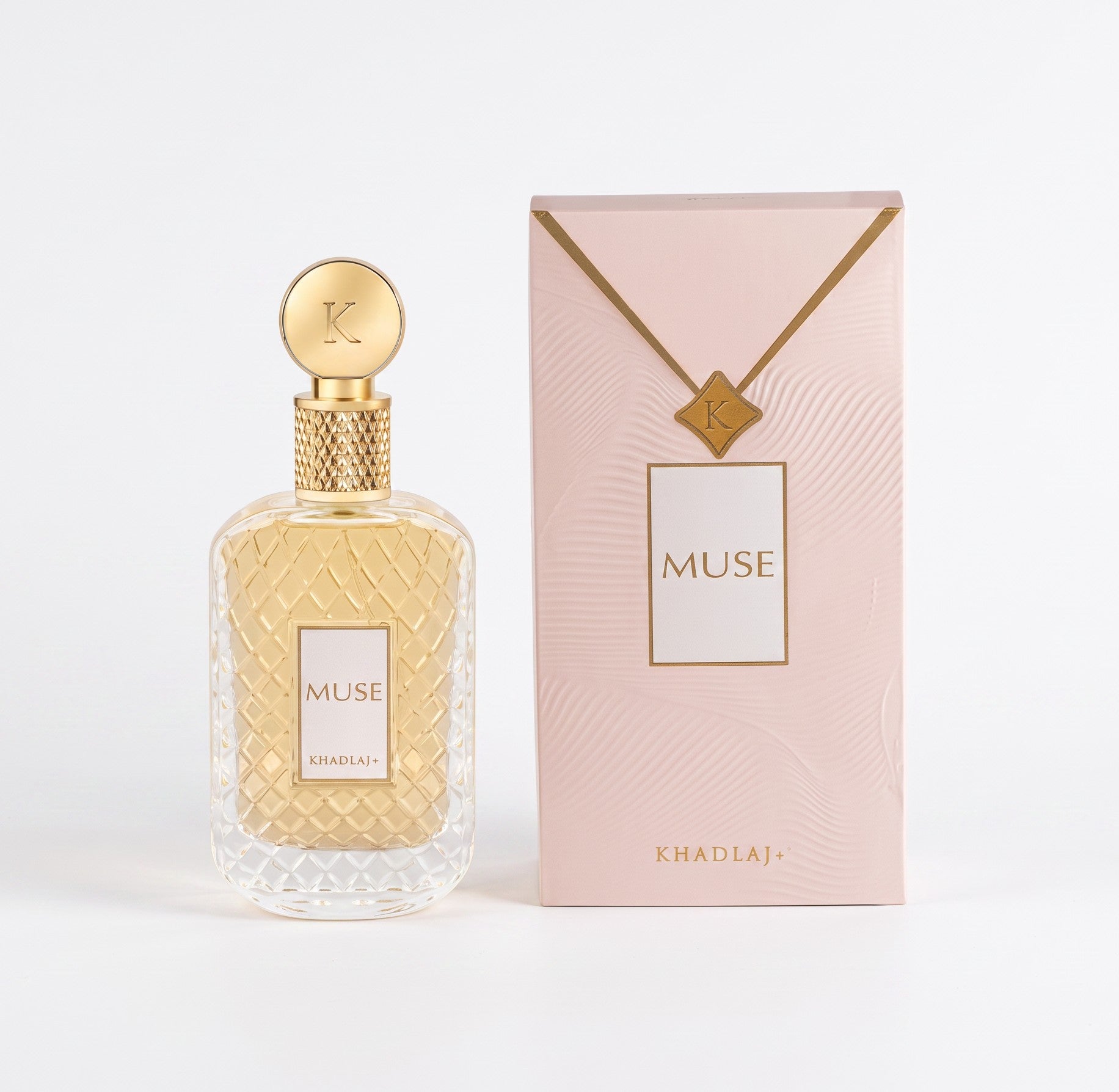 Palette 21 KHADLAJ Muse Eau de Parfum in a textured glass bottle with a gold cap next to its elegant pink gift box.