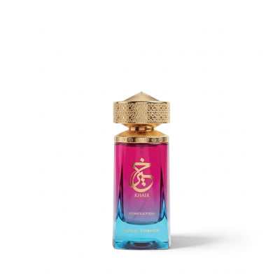 Palette 21 Khair Confection Eau de Parfum in a gradient magenta and blue glass bottle with an ornate gold cap.