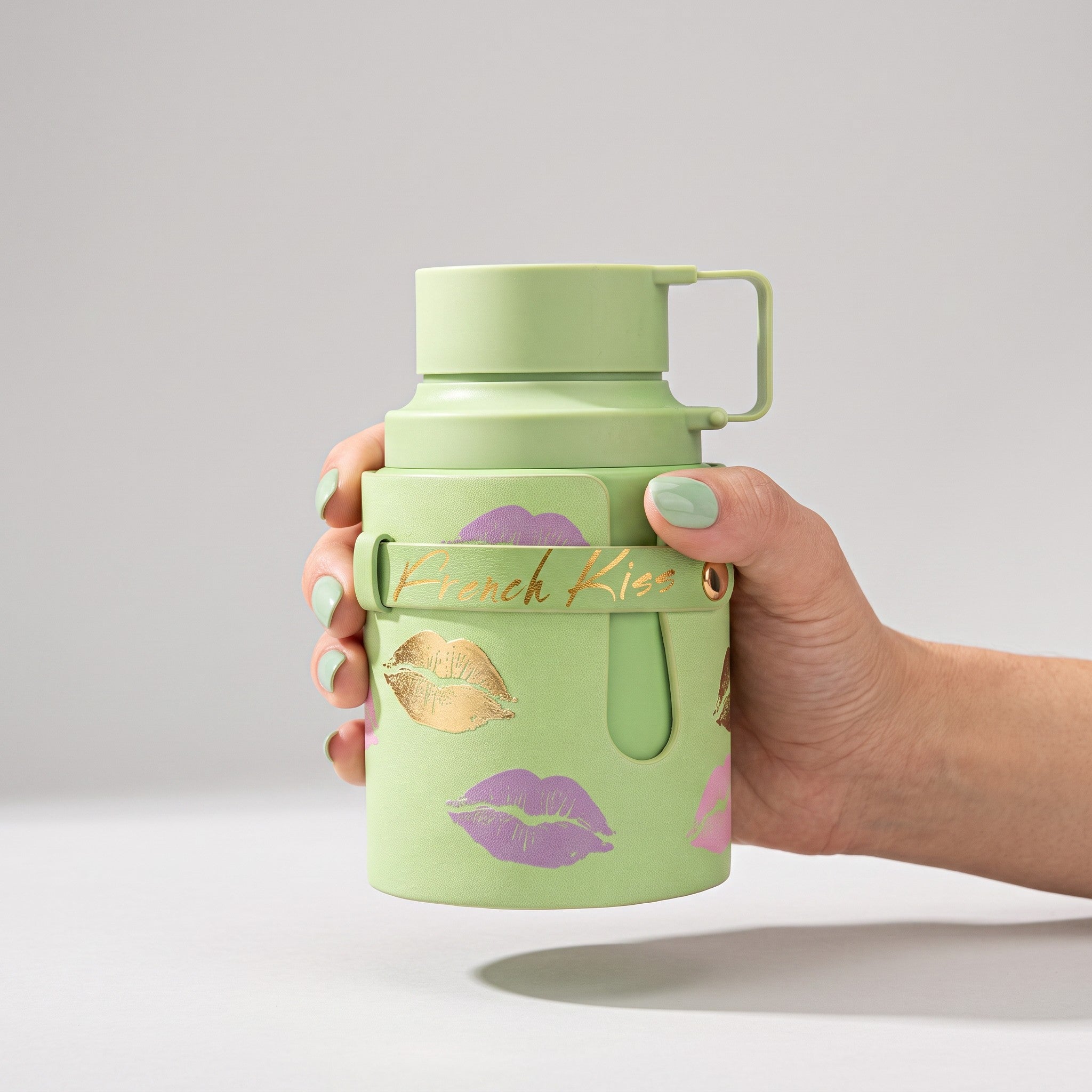 Palette 21 odyssey French Kiss light green water bottle with gold and purple lip print and matching carry strap