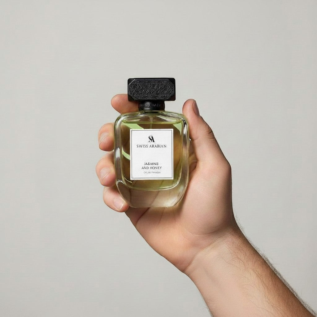 Palette 21 Swiss Arabian Jasmine and Honey Eau de Parfum bottle held in a hand against a neutral background.