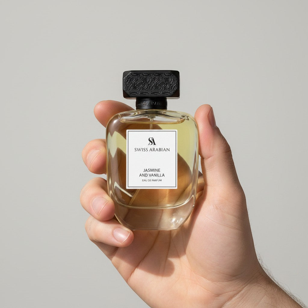 Palette 21 hand holding a glass bottle of Swiss Arabian Jasmine and Vanilla Eau de Parfum with a textured black cap.