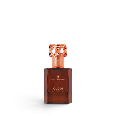 Palette 21 Swiss Arabian Oud 01 unisex woody fragrance in a brown glass bottle with an ornate rose gold cap.