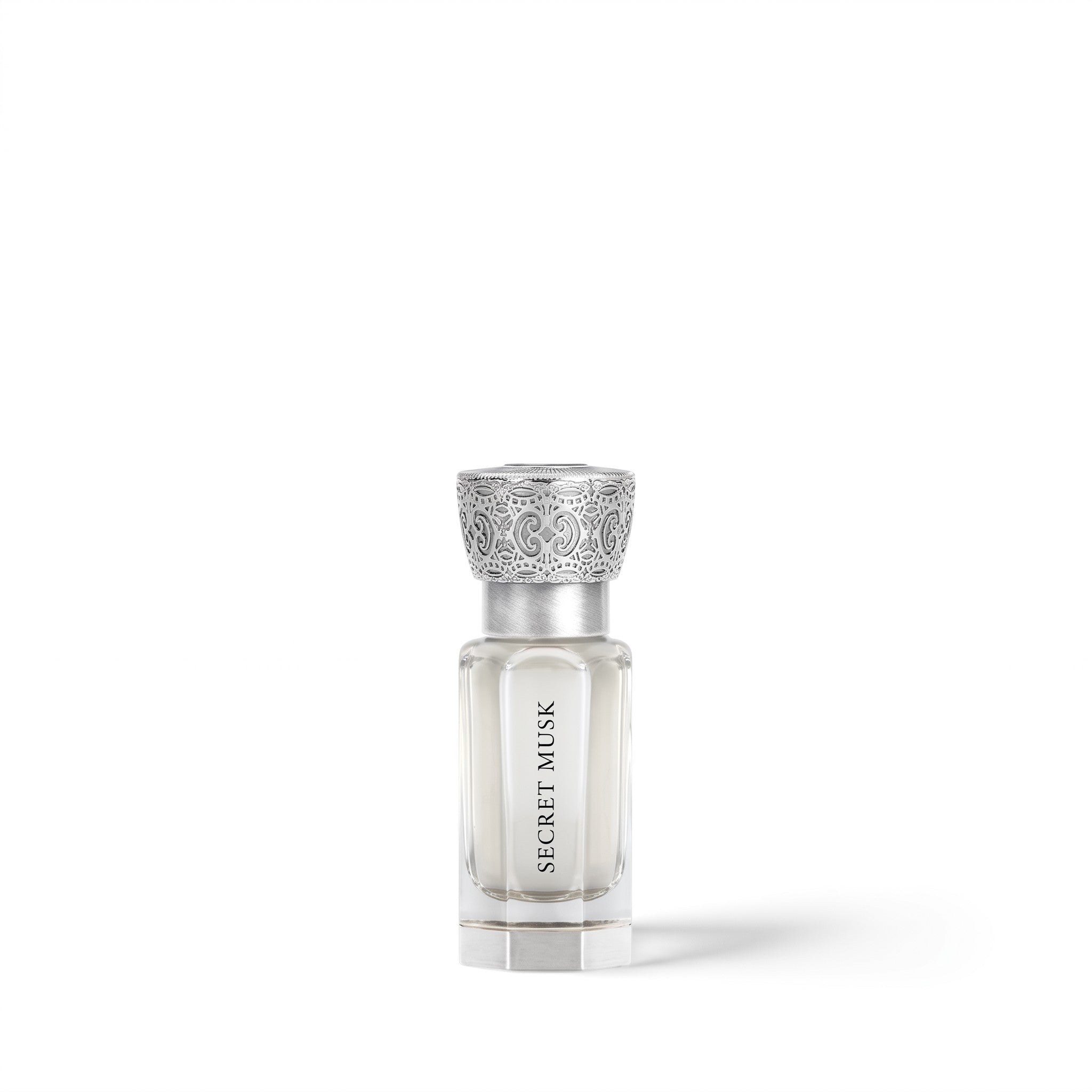 Palette 21 SWISS ARABIAN Secret Musk concentrated perfume oil in a glass bottle with an ornate silver cap.