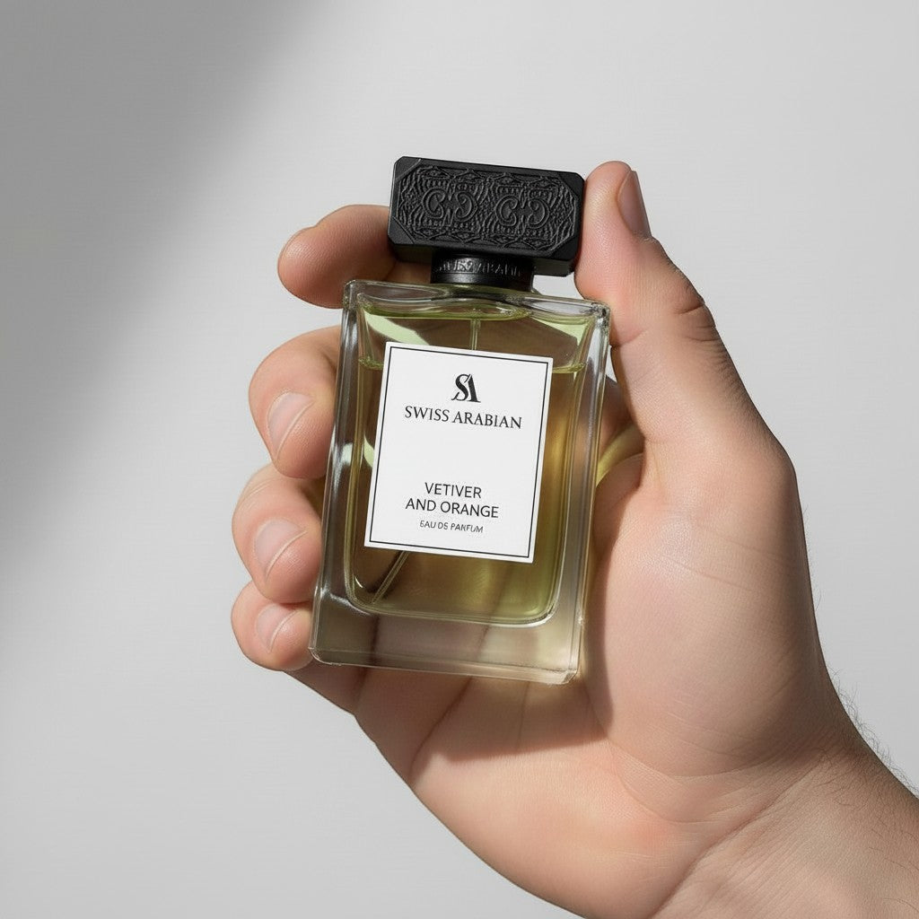 Palette 21 Swiss Arabian Vetiver and Orange Eau de Parfum in a clear glass bottle held in a hand