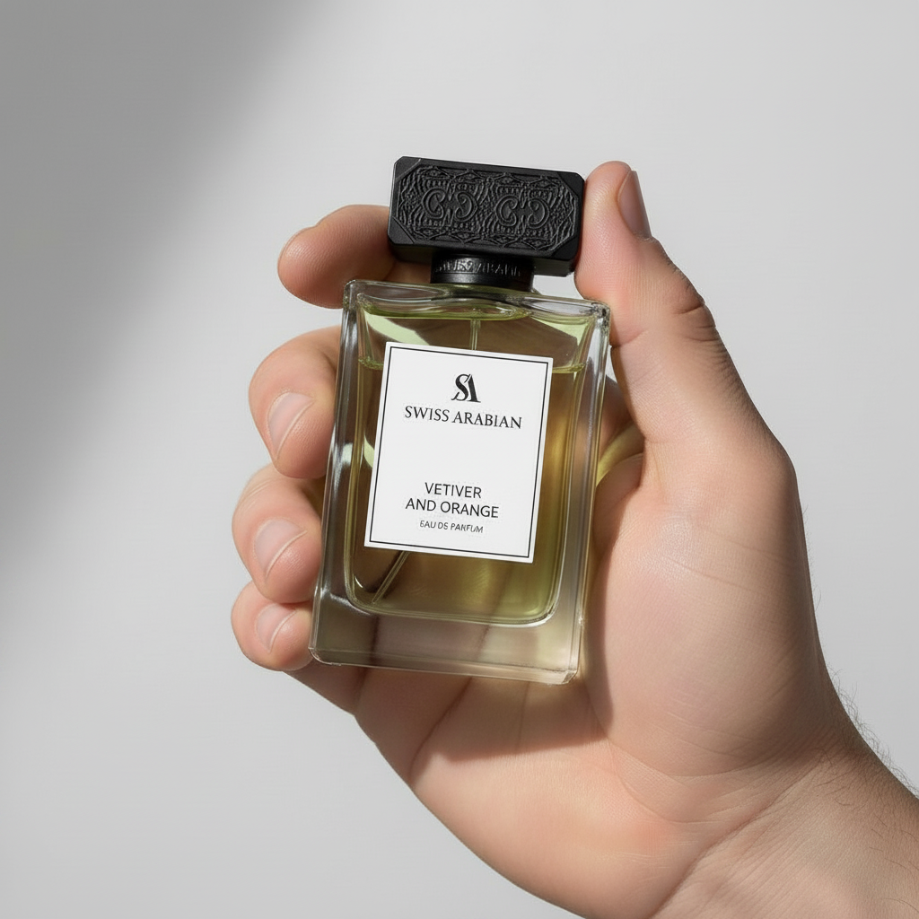 Palette 21 Swiss Arabian Vetiver and Orange Eau de Parfum in a clear glass bottle held in a hand