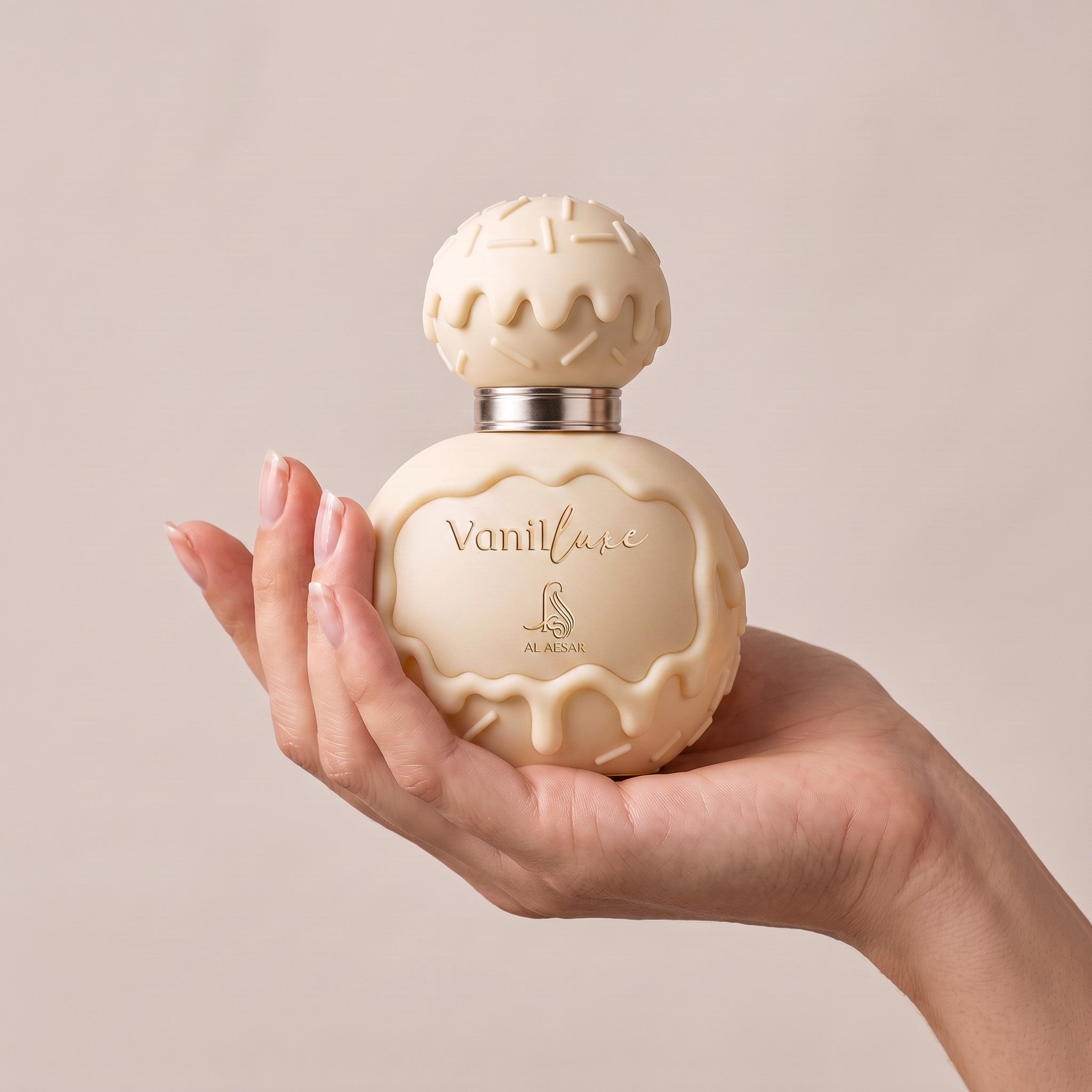 Palette 21 AL ASRAR Vanilluxe Eau de Parfum in a cream-colored bottle with a unique dripping icing design held in hand.