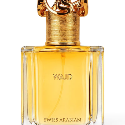 Palette 21 WAJD Swiss Arabian perfume in a clear glass bottle with an ornate gold cap and amber liquid