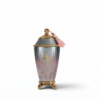 Palette 21 Zimaya Ghali Elegant Eau de Parfum in a gradient pink glass bottle with gold accents and a pink tassel.
